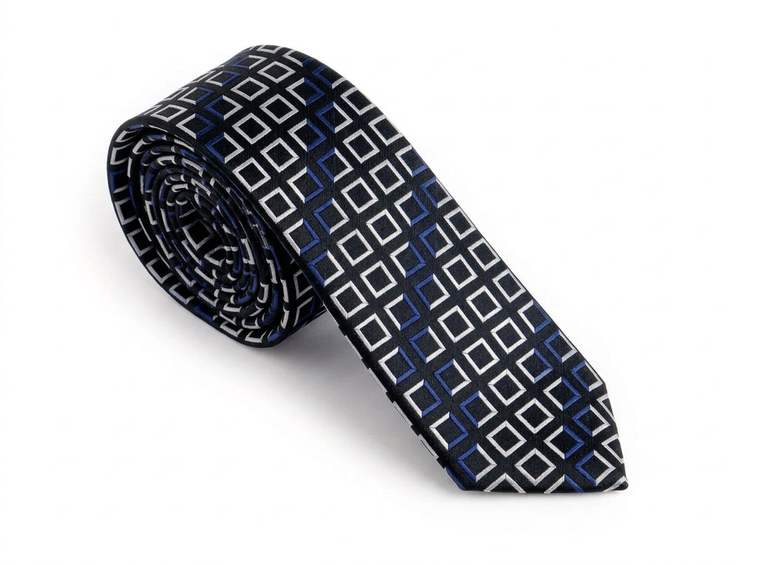 A rolled necktie featuring a geometric pattern of white and blue squares on a black background, set against a plain white studio backdrop.