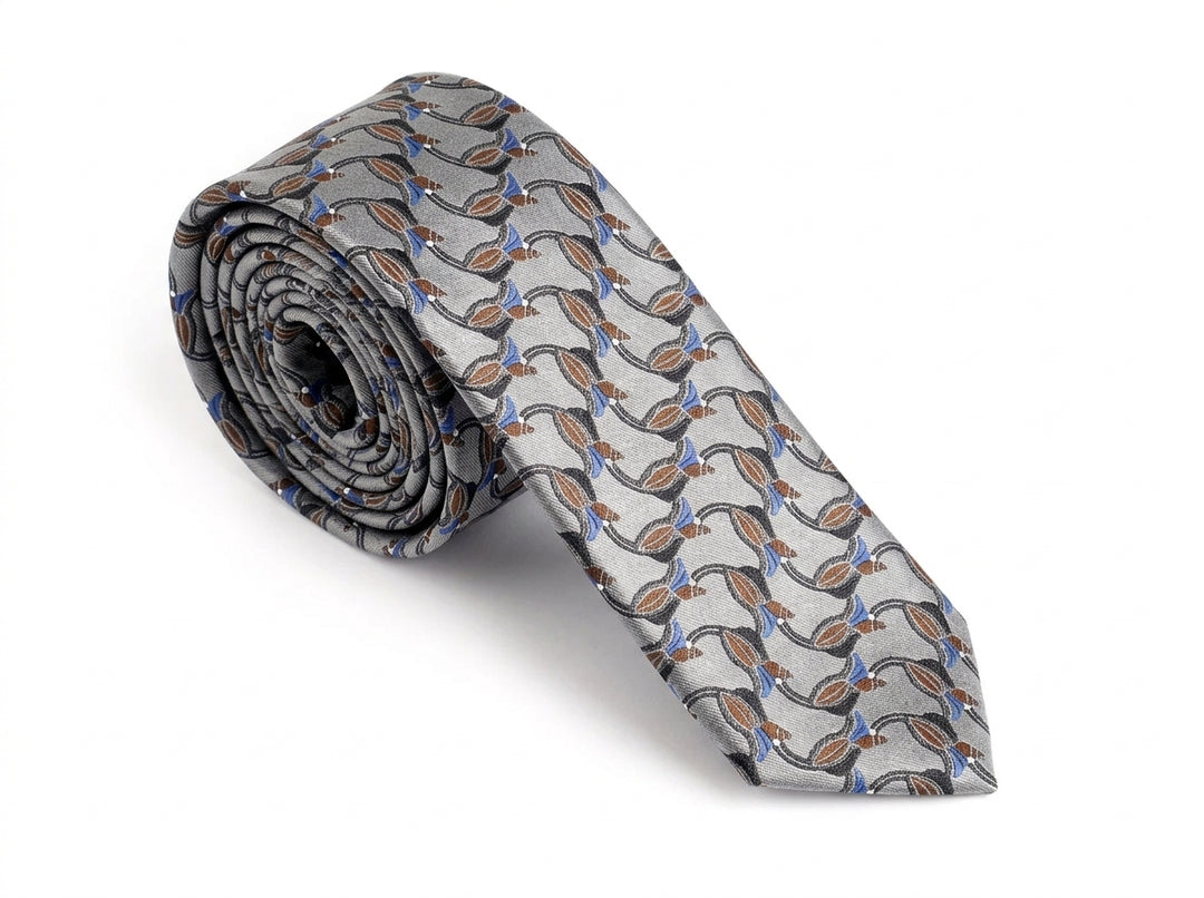 A rolled necktie with a repeating pattern of stylized brown and blue birds on a light gray background, displayed on a clean white studio background.