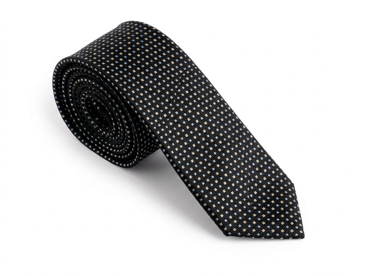 A black necktie with a small white geometric dot pattern, rolled and displayed on a clean white background.