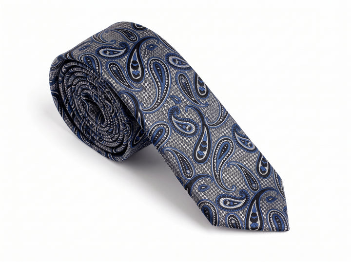 A rolled necktie featuring a detailed paisley pattern in shades of navy blue, gray, and white, set against a clean white background.