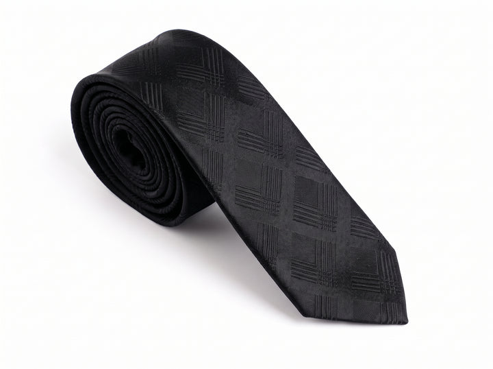 A black textured necktie with a subtle diagonal grid pattern, rolled on the left and laid out diagonally on a white background.
