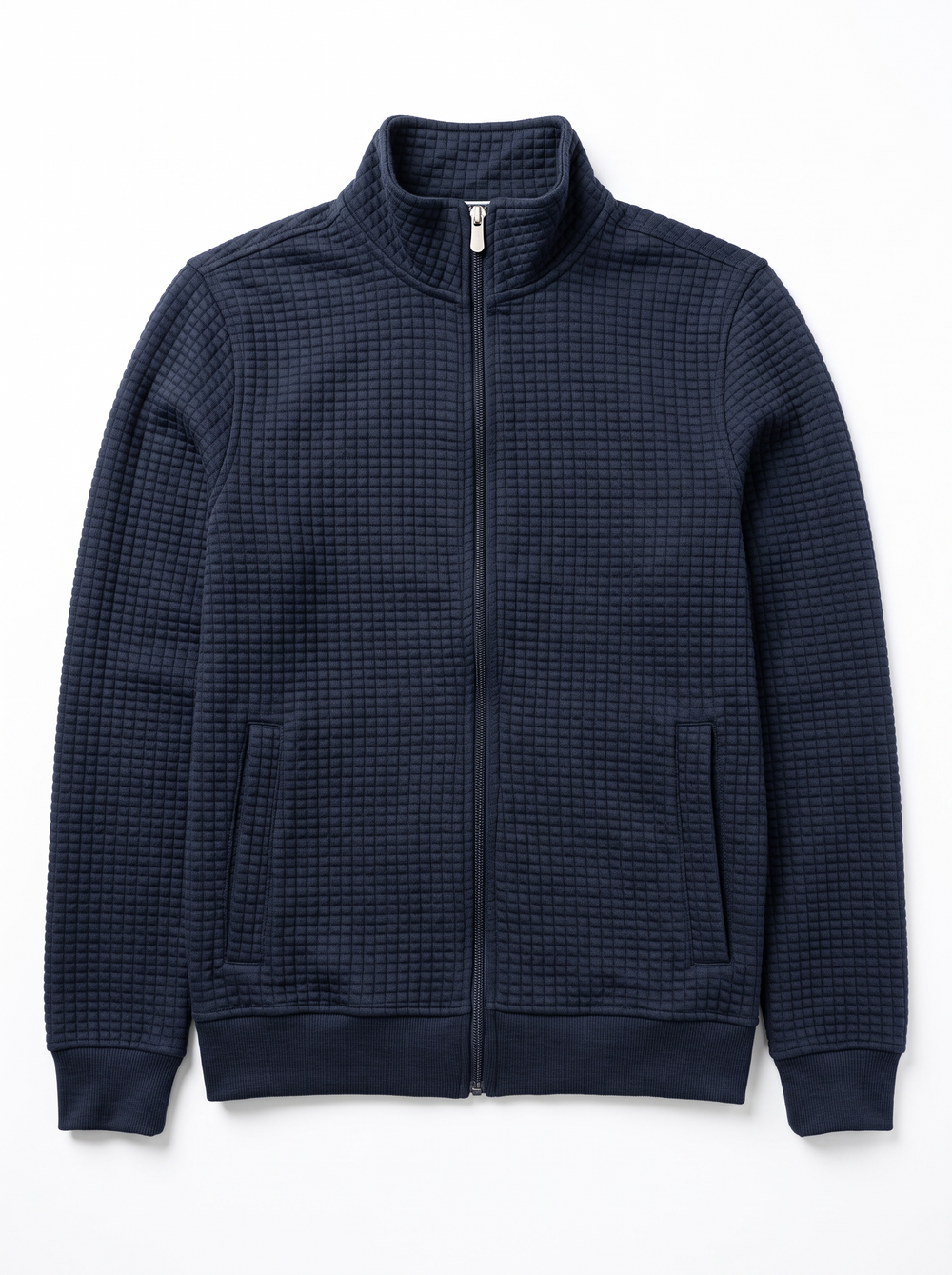 A navy blue waffle-knit zip-up jacket with a stand collar, ribbed cuffs and hem, and two front handwarmer pockets, shown flat on a white background.