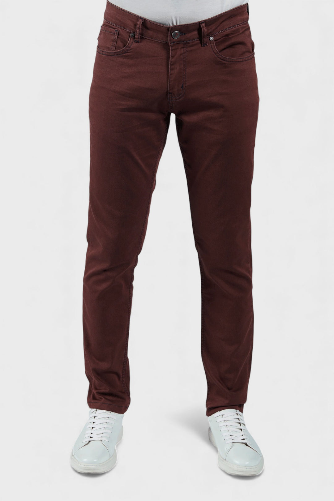 Brown pants worn by a person on a white background