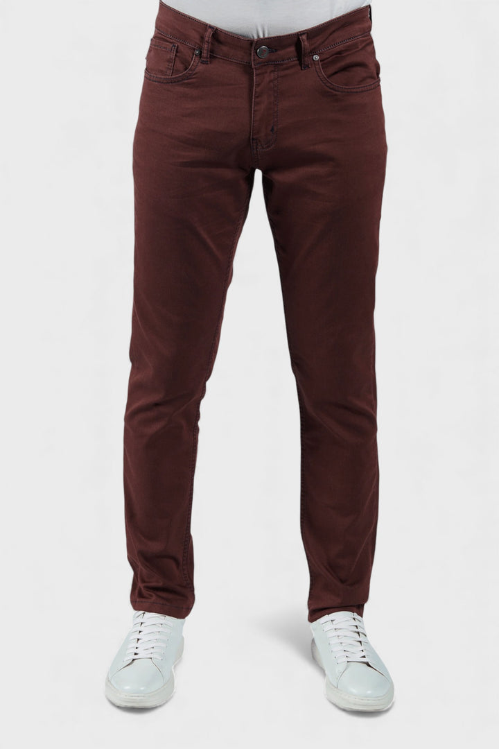 Brown pants worn by a person on a white background