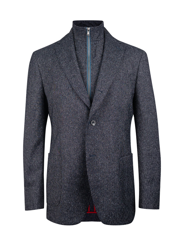 A men's single-breasted blazer in a dark navy and gray heathered tweed fabric, featuring a high stand collar with a visible front zipper, a single button closure, and front patch pockets.