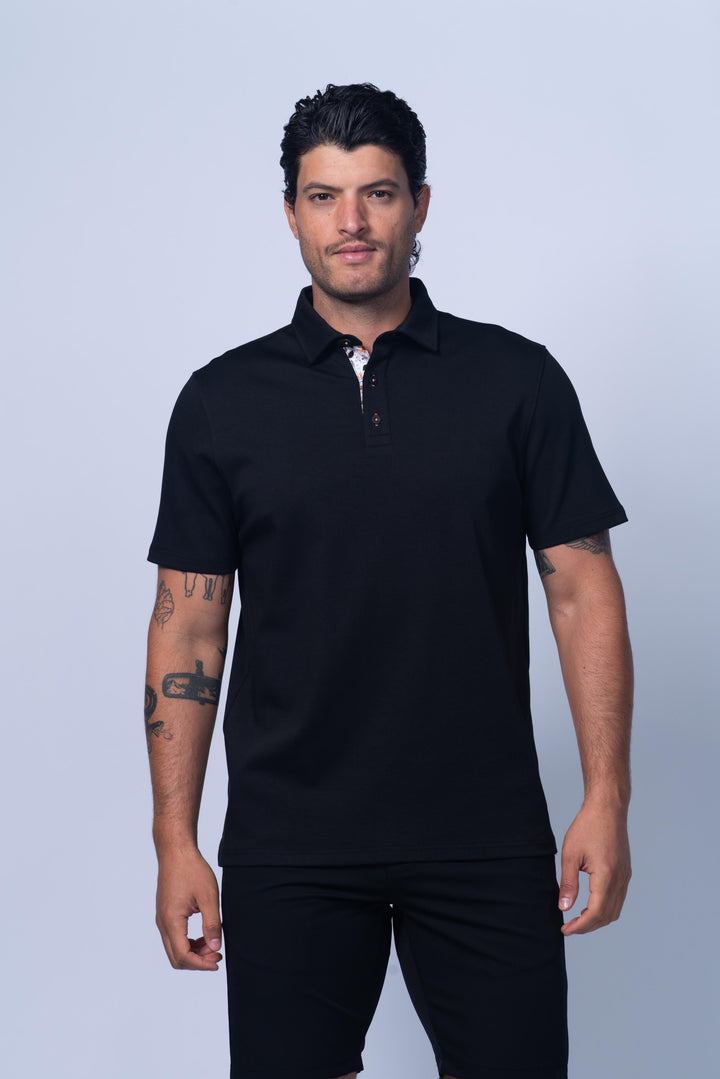 Man wearing a black polo shirt