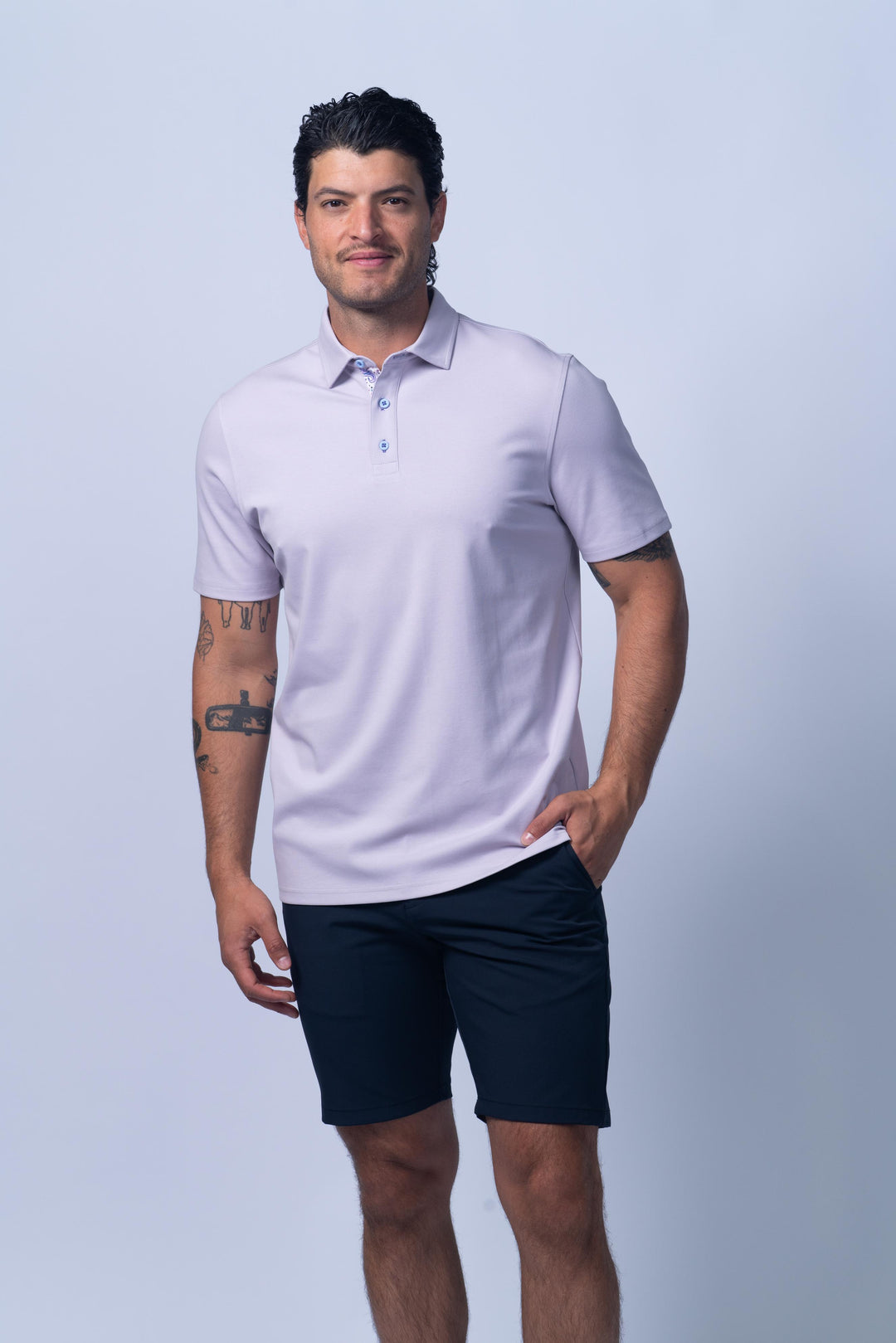 Man wearing a light purple polo shirt
