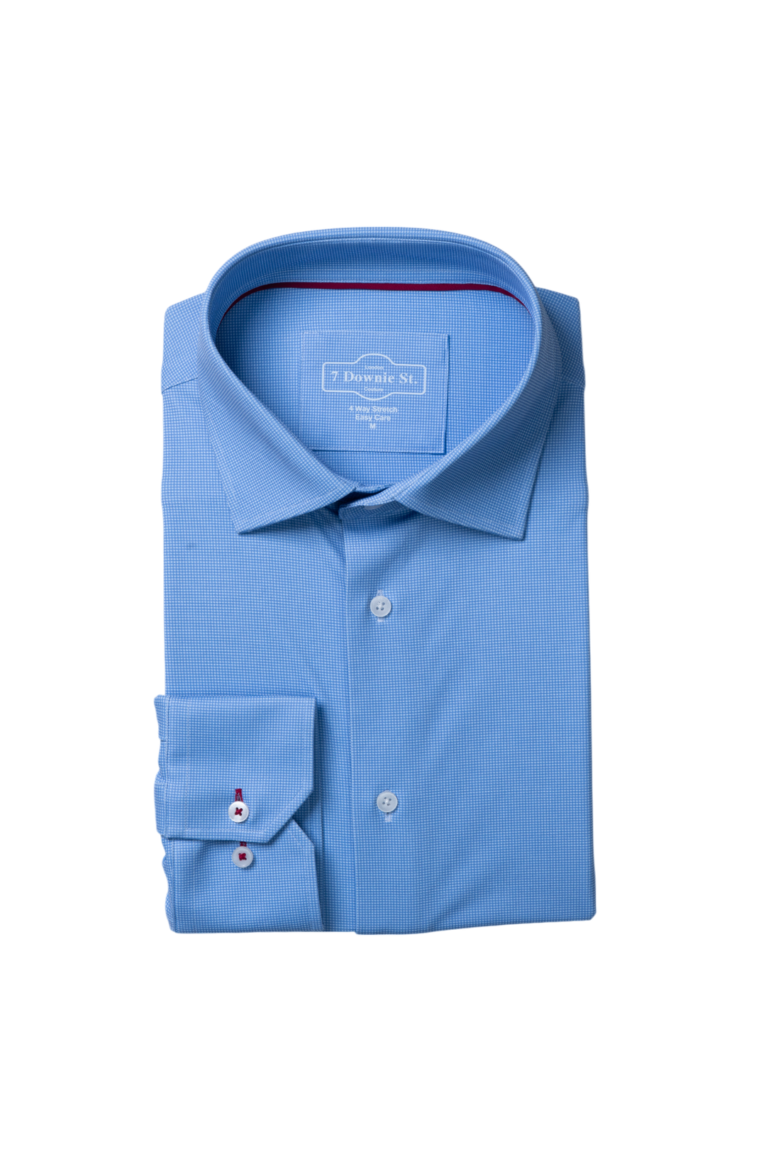 Light blue folded SilkTouch Knit Shirt with standard collar and button closure, showcasing a relaxed fit.