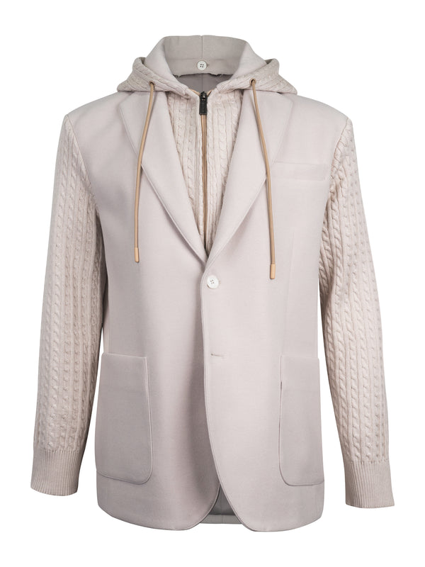 A light beige hooded blazer with cable-knit sleeves and a zippered front