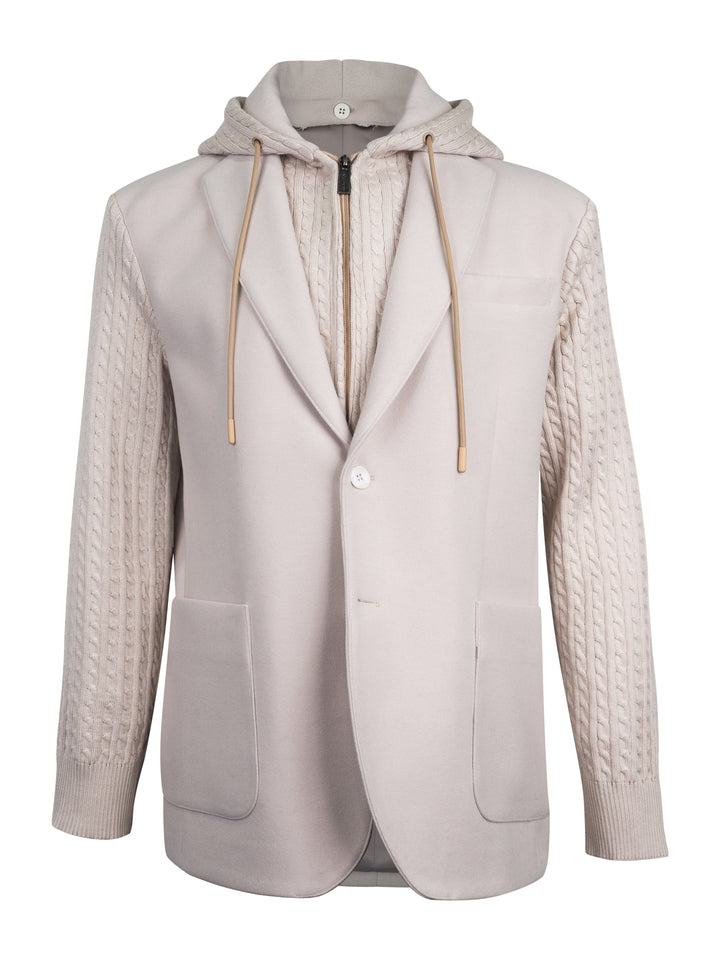 A light beige hooded blazer with cable-knit sleeves and a zippered front