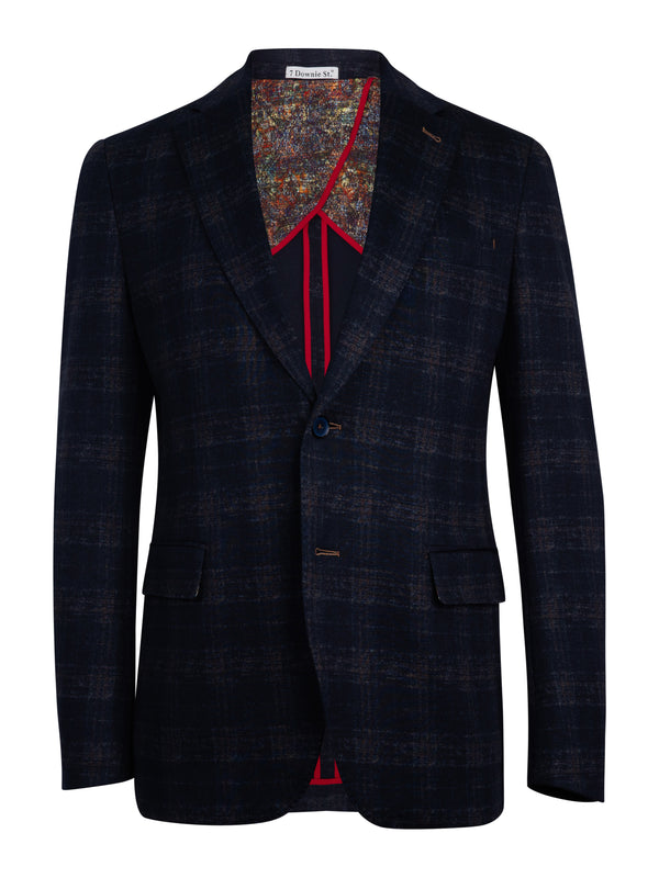 A man wearing a dusty blue and copper sport coat with a refined check pattern and notched lapel.