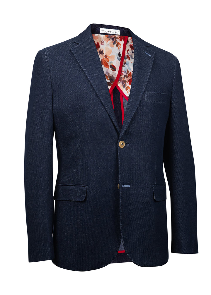 Navy blazer with a patterned shirt and red tie on a white background