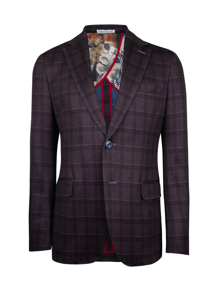 A dark purple and black plaid blazer jacket with a patterned shirt and red tie visible underneath
