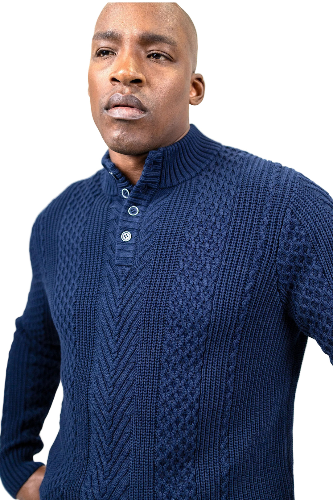 A man wearing a navy blue cable-knit mock-neck sweater with a three-button placket, photographed against a plain white background.